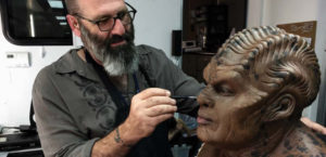 Howard Berger airbrushing Chad Coleman as Klyden for The Orville